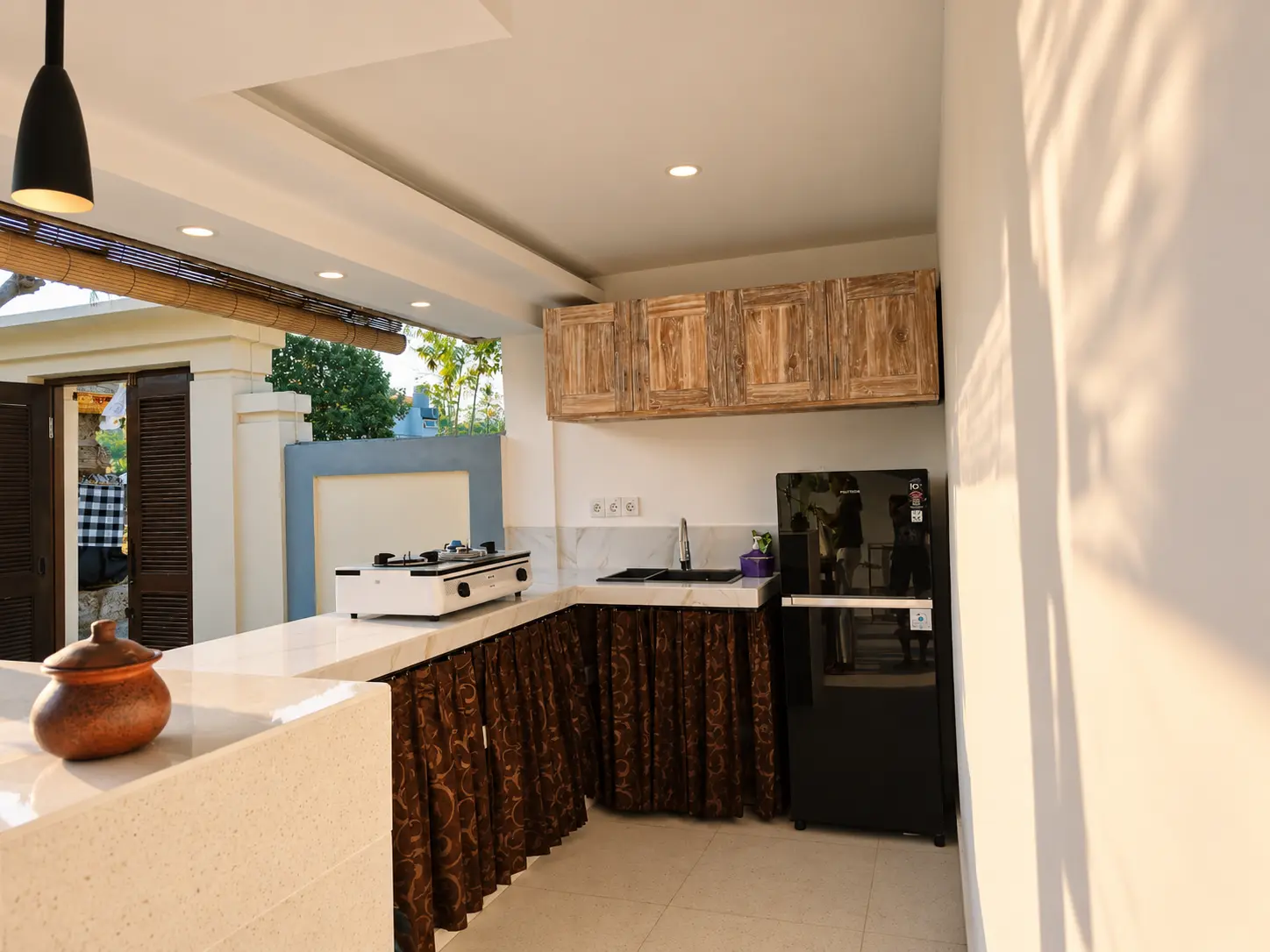 Kitchen with stove and refrigerator